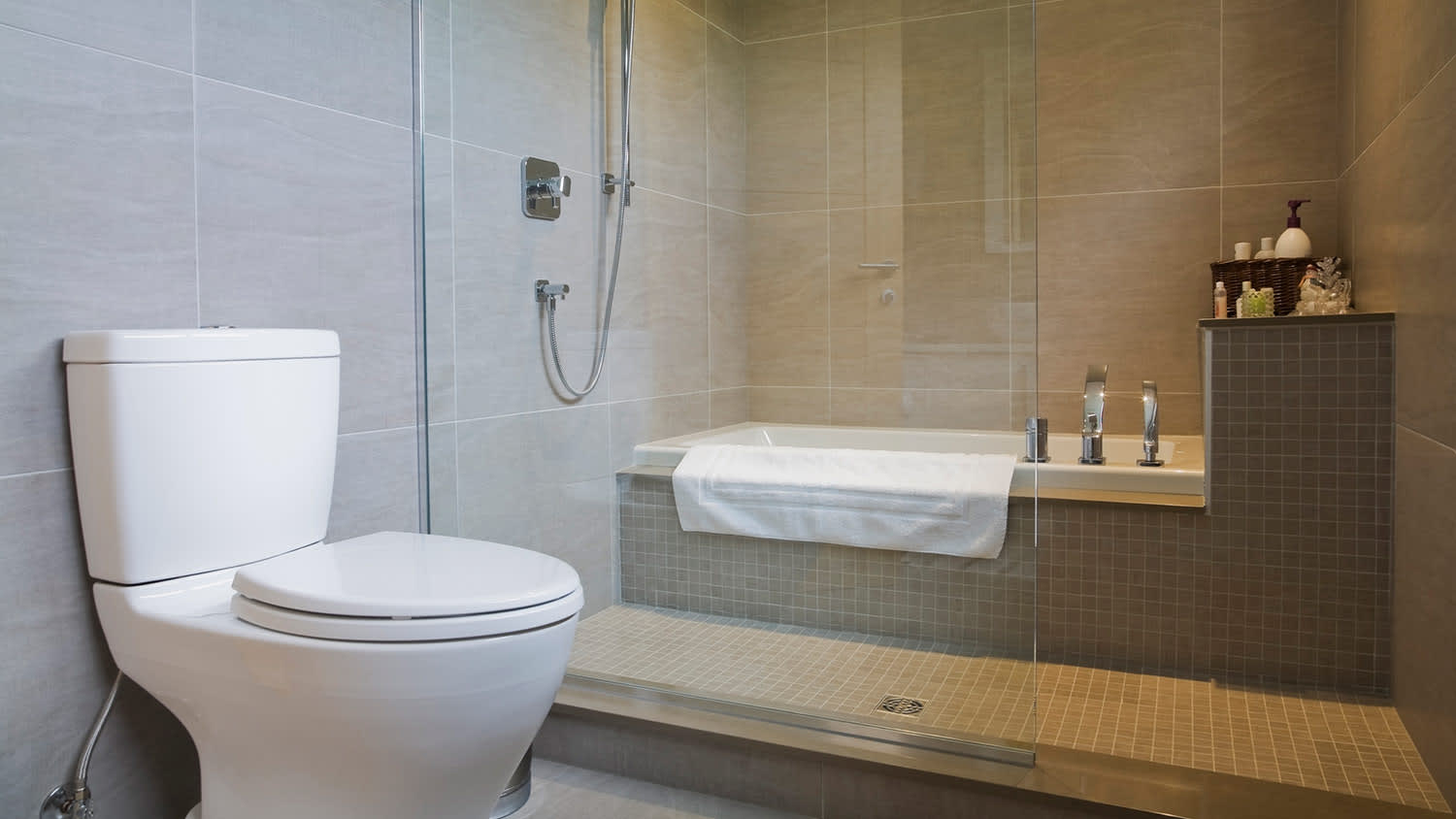 Modern bathroom with large tile walls