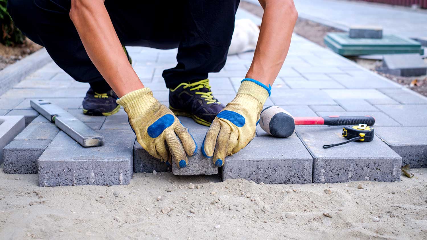 Man laying pavers