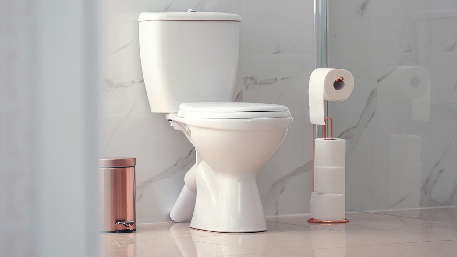 modern toilet bowl in marble bathroom
