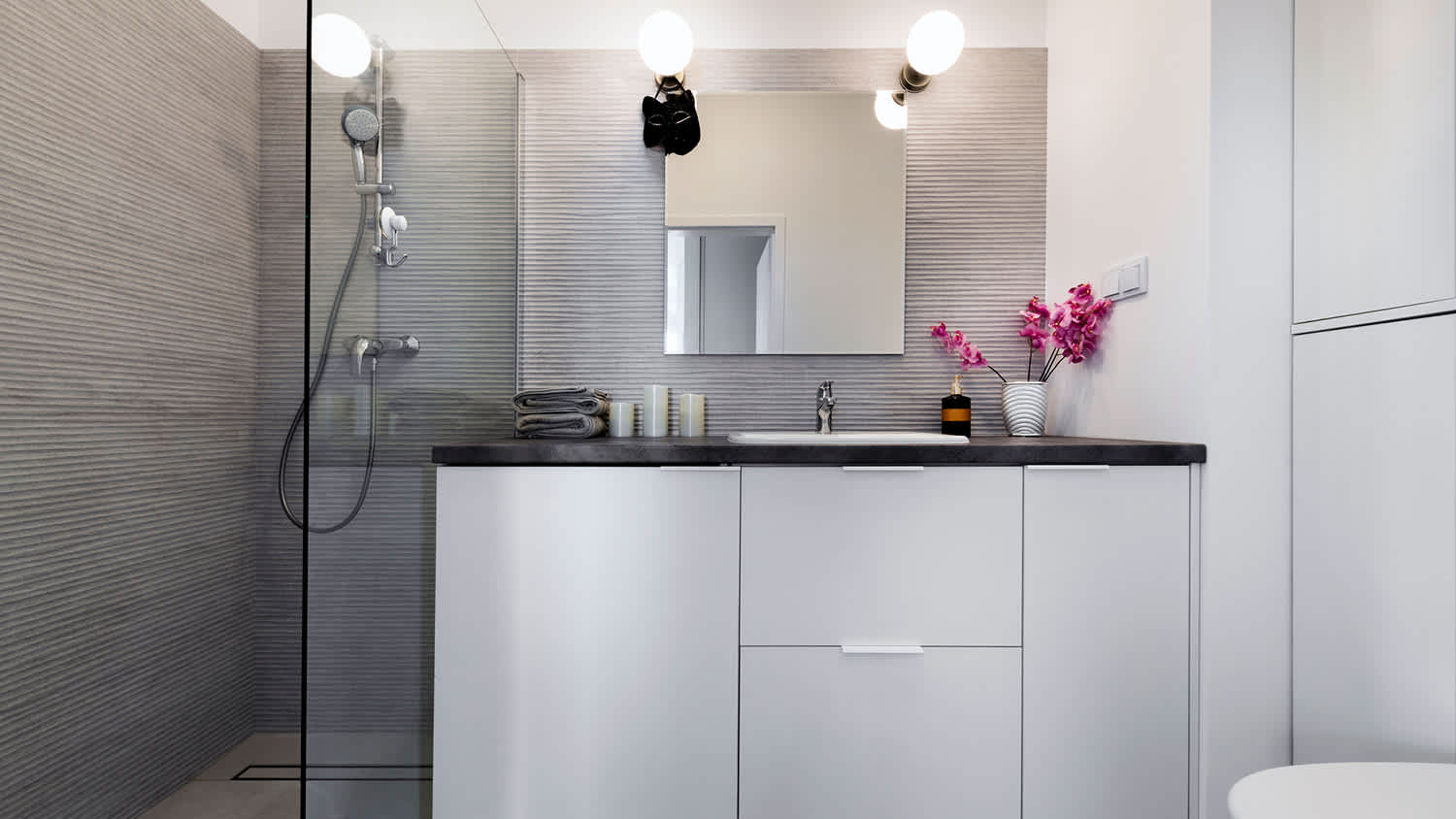 Grey textured tile walls in bathroom