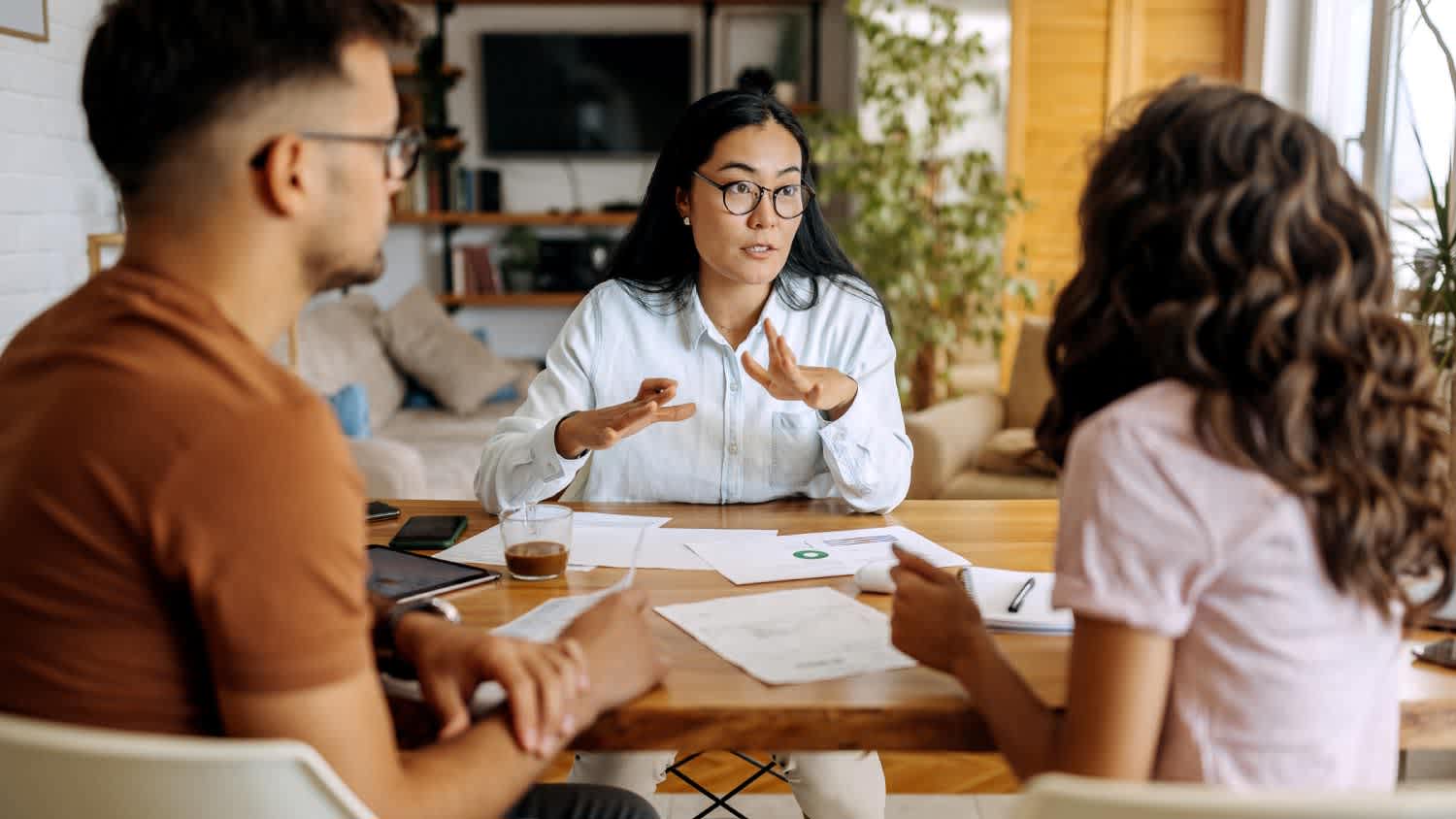 A young couple getting advice from financial expert