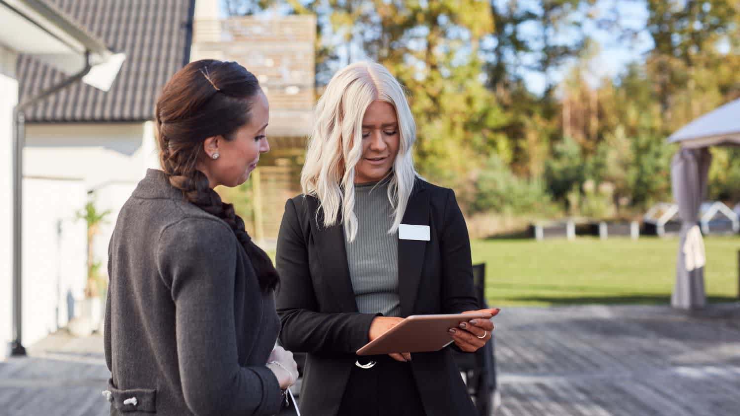 A real estate agent talking to a client