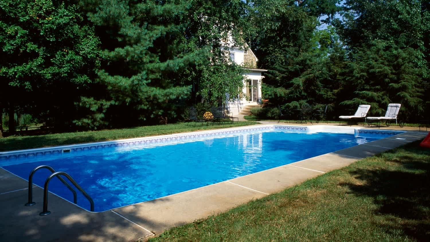 swimming pool in large backyard