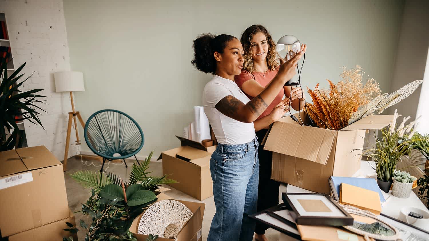 A couple unpacking boxes in a new apartment