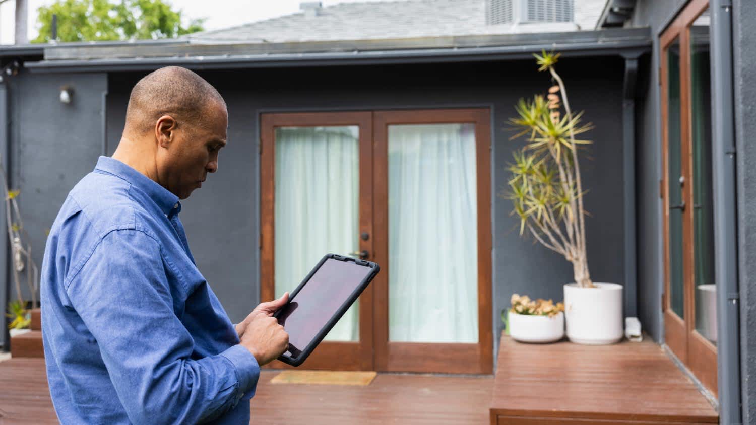 A male real estate agent using digital tablet
