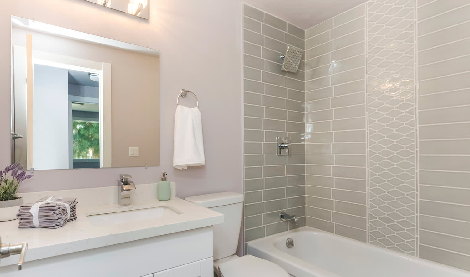 Patterned shower tiles in greige neutral color