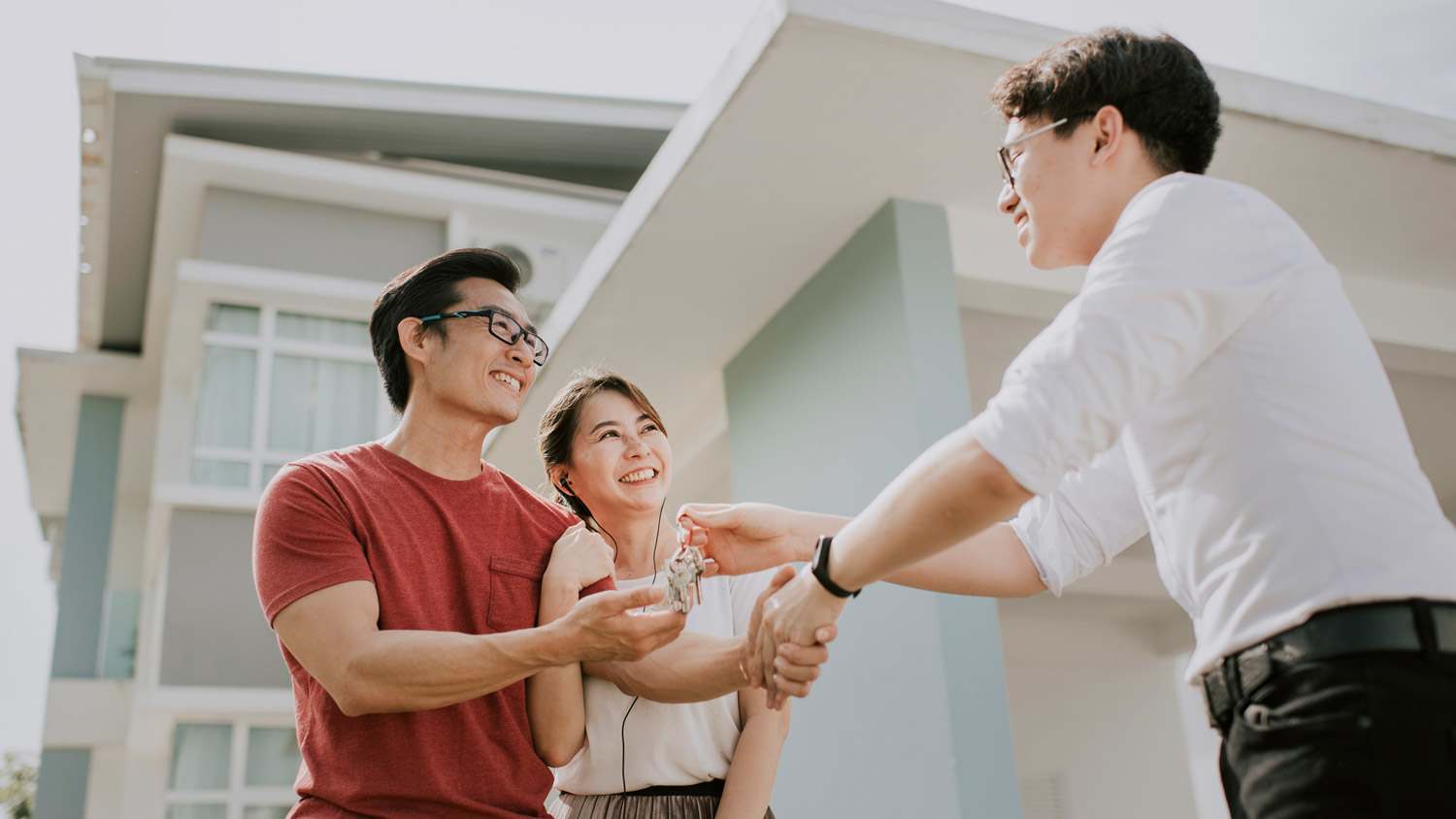 A couple getting the keys to their new house
