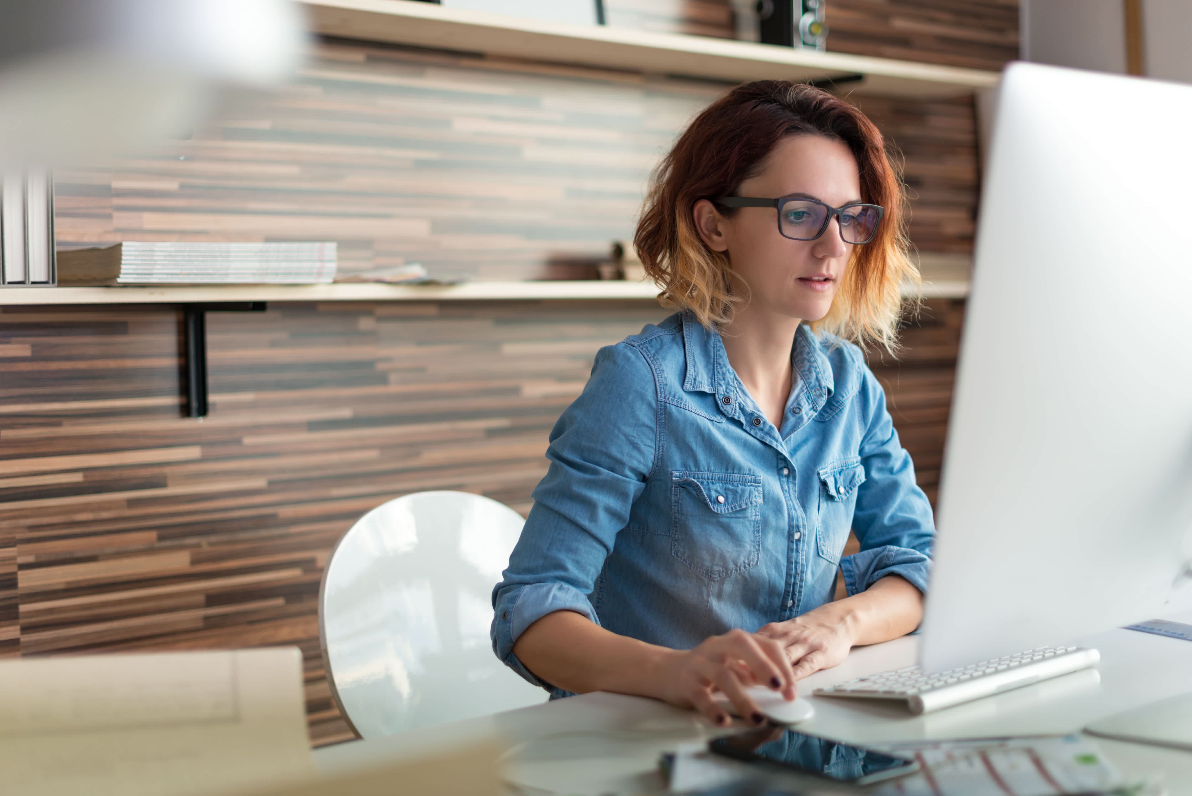 Woman working at home on a computer