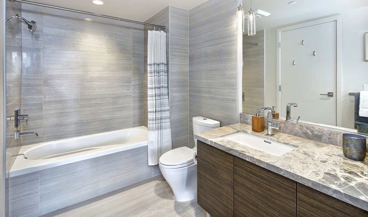Grey matte tiled walls in stylish modern bathroom