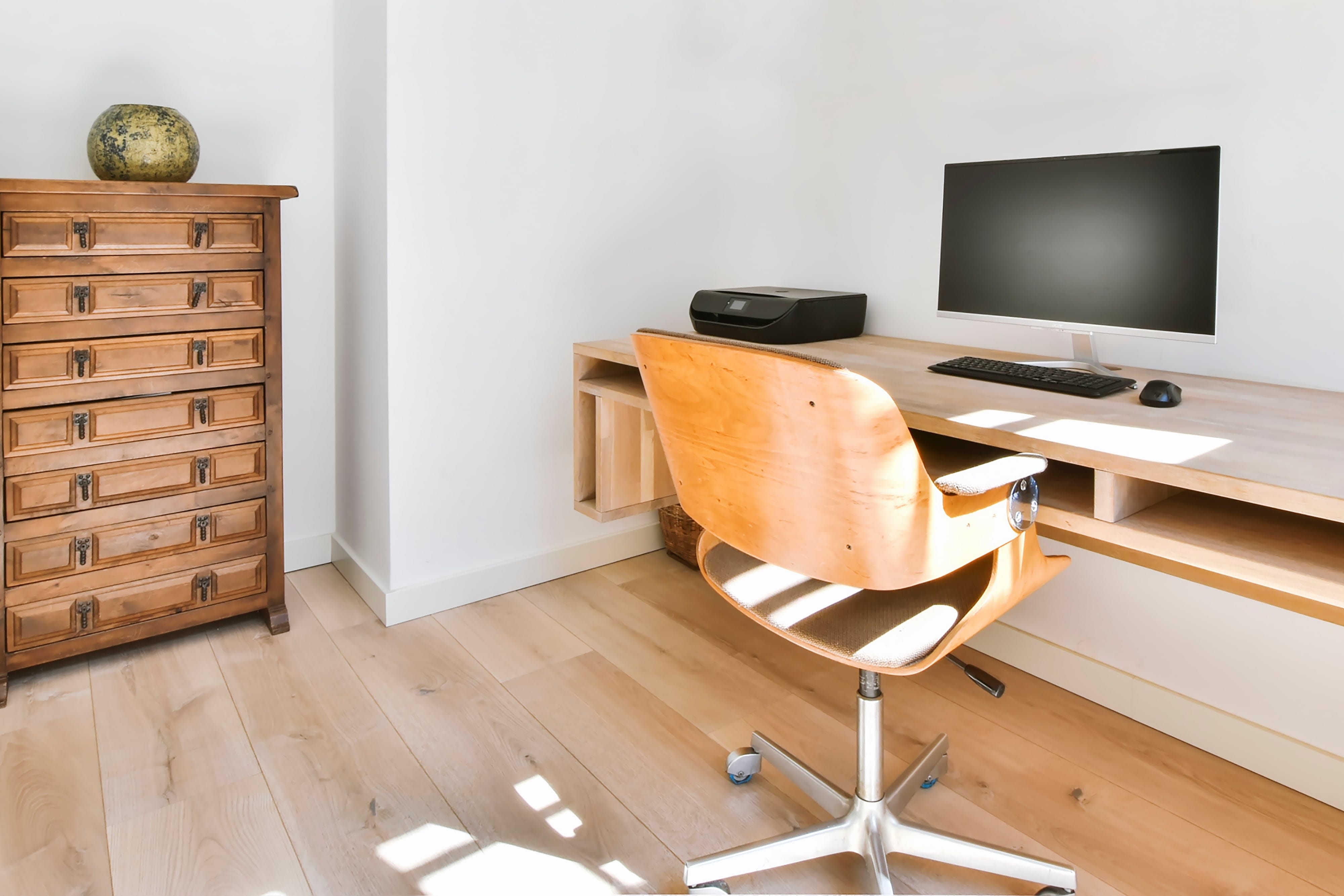 Floating modern console used as a computer desk
