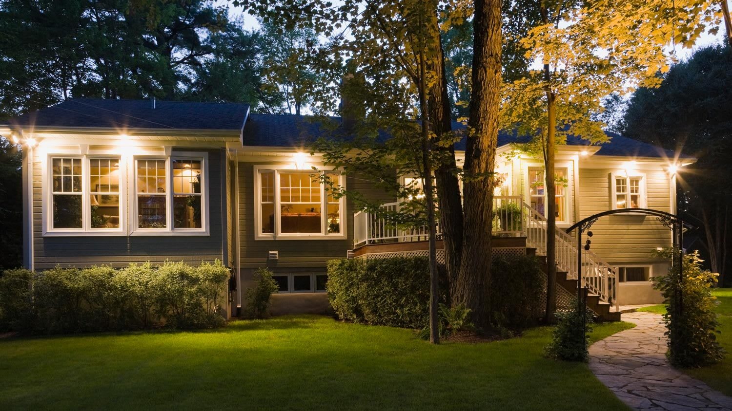 The exterior of a house with the security lights turned on