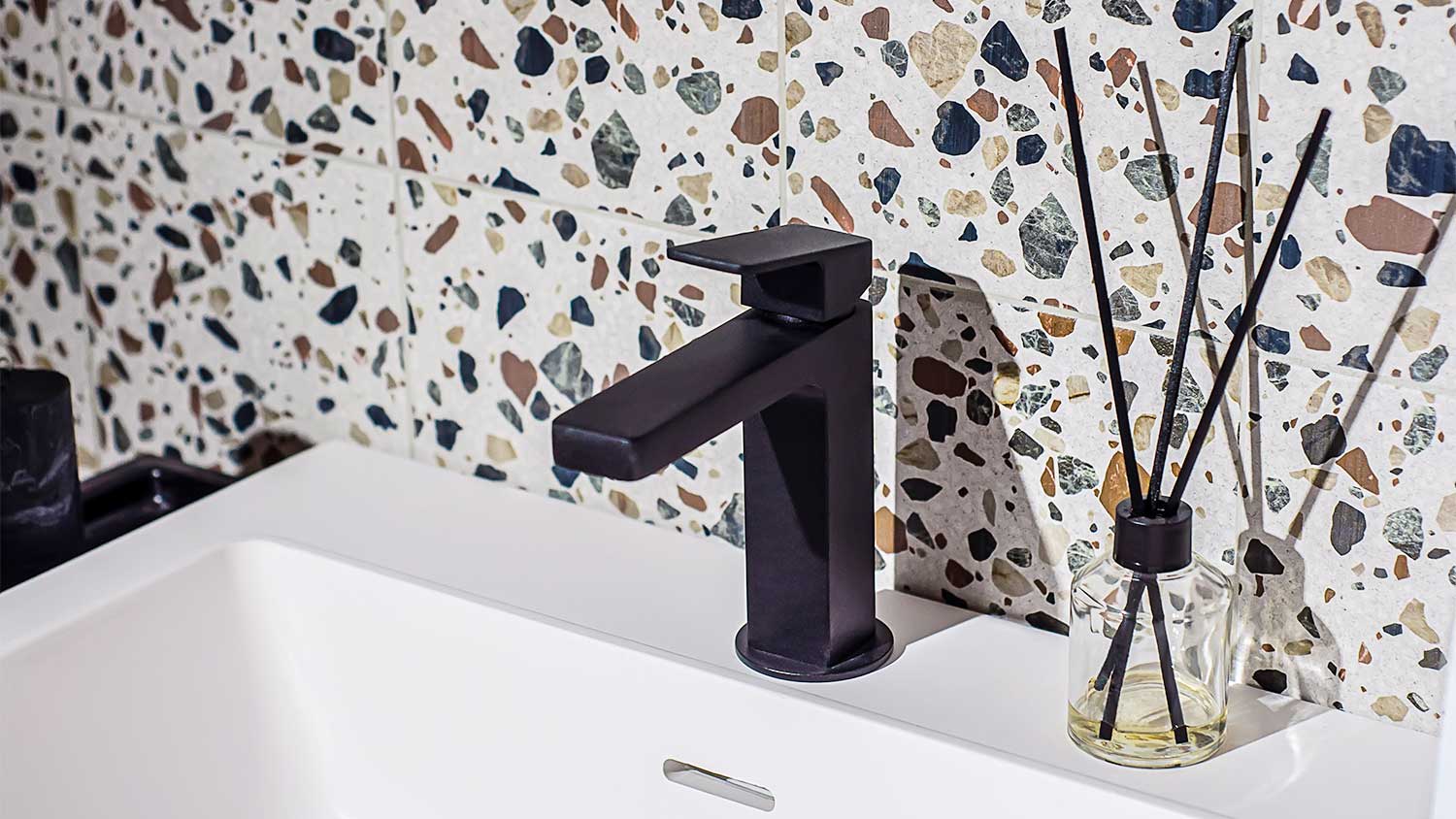 Terrazzo tile above bathroom sink