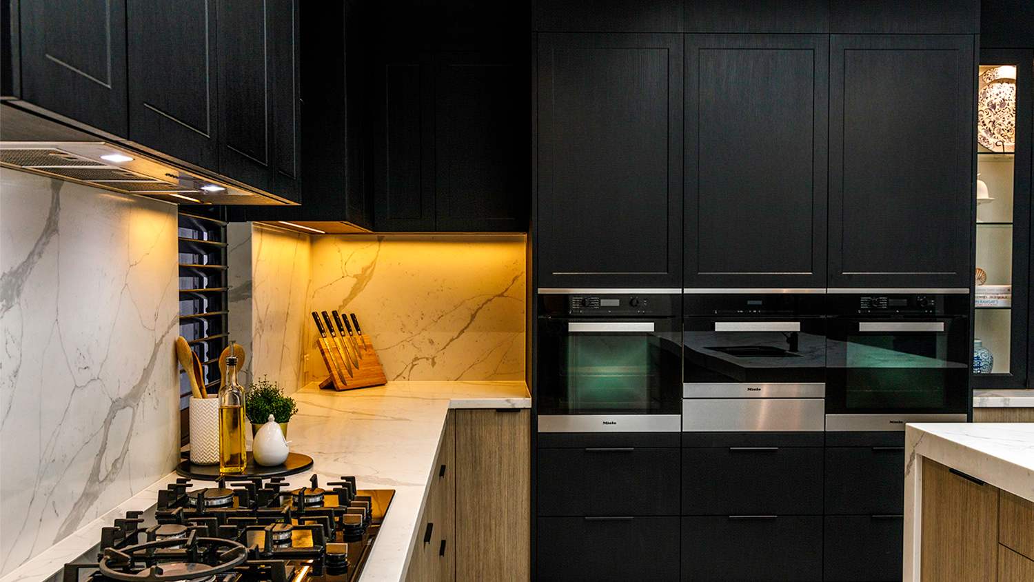 kitchen with white cabinets and bay window