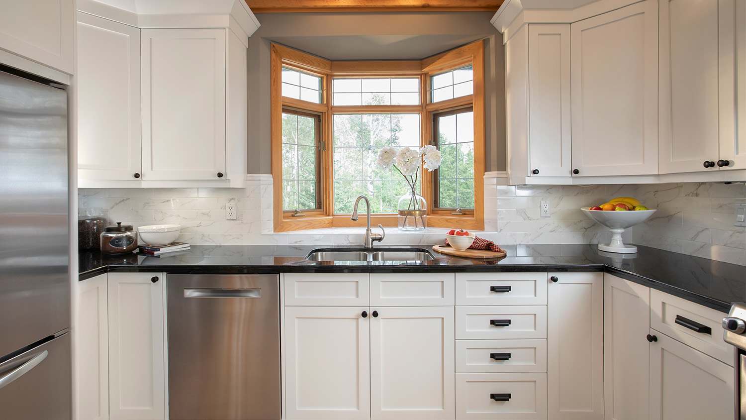 A modern kitchen with black cabinets