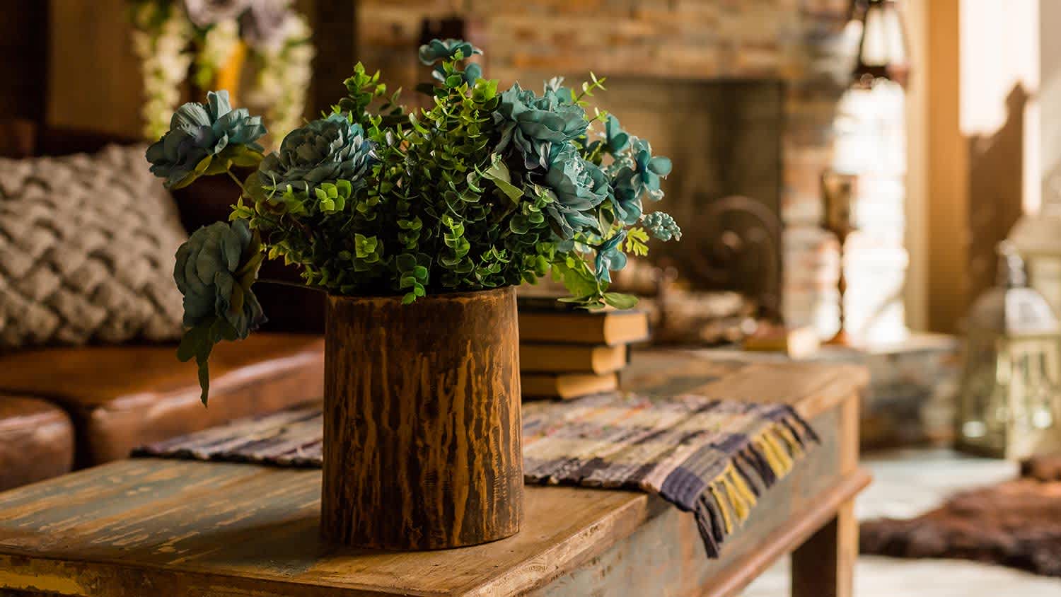 faux plant in a wooden vase