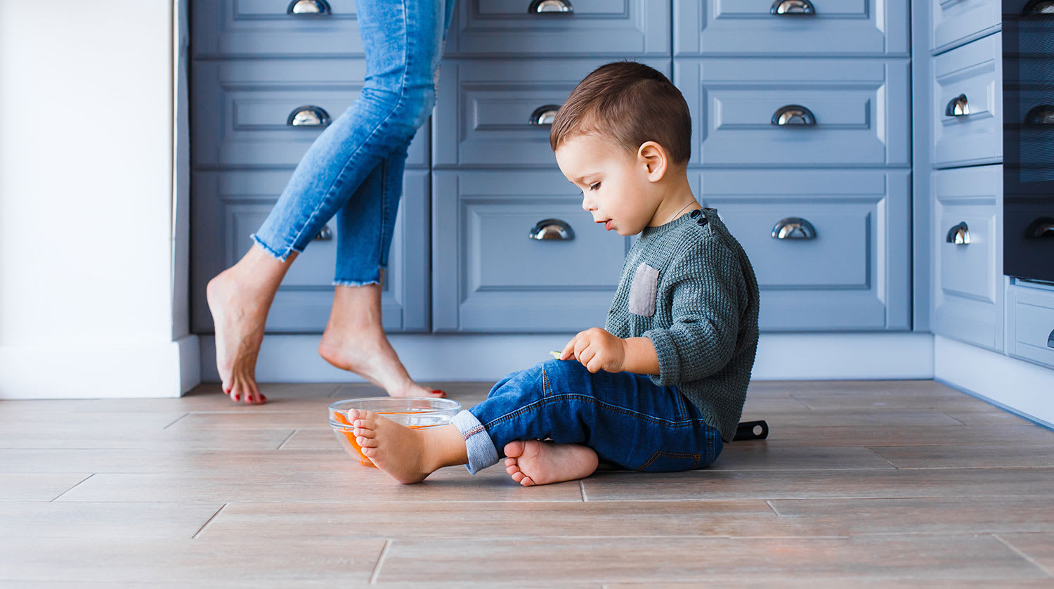 Child plays in kitchen