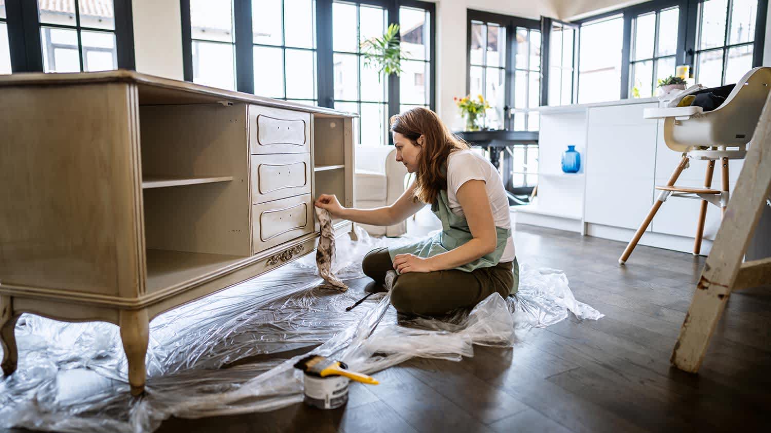 woman repairing old furniture