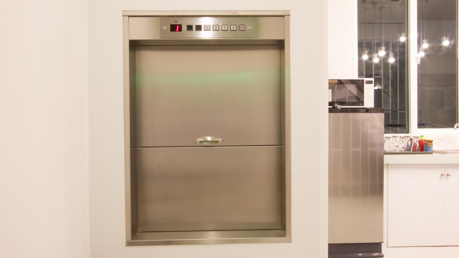 A dumbwaiter lift elevator in a kitchen