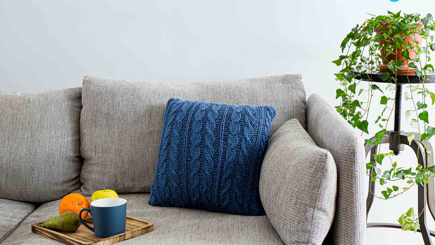 blue knit pillow case on couch