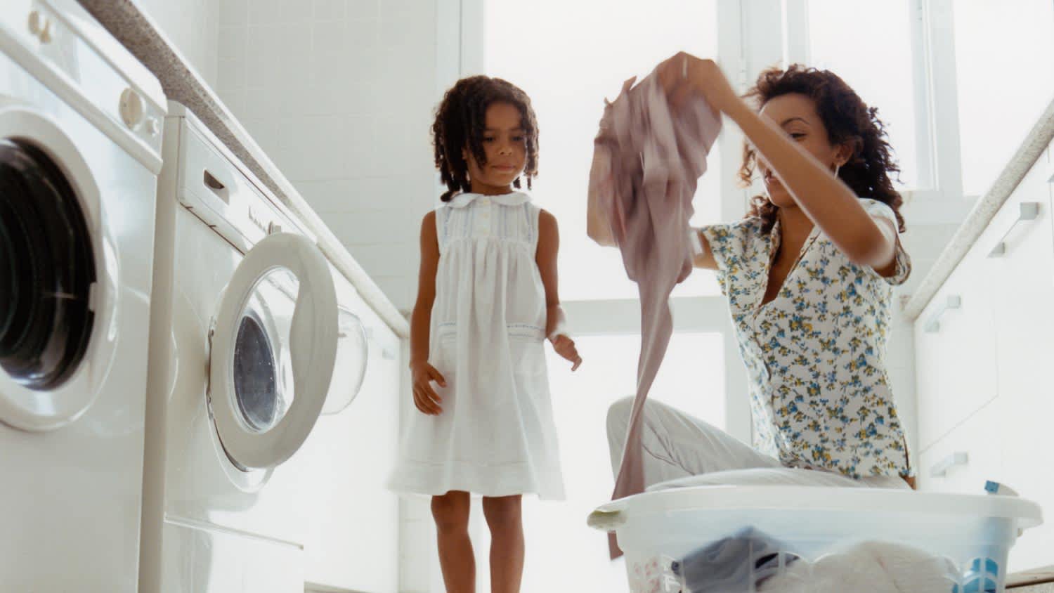 Mom and daughter doing laundry