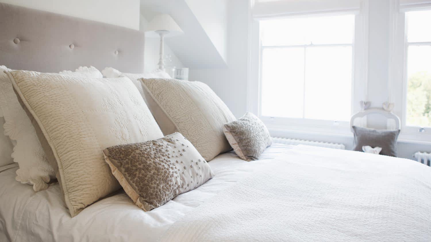 A bedroom in soft light colors