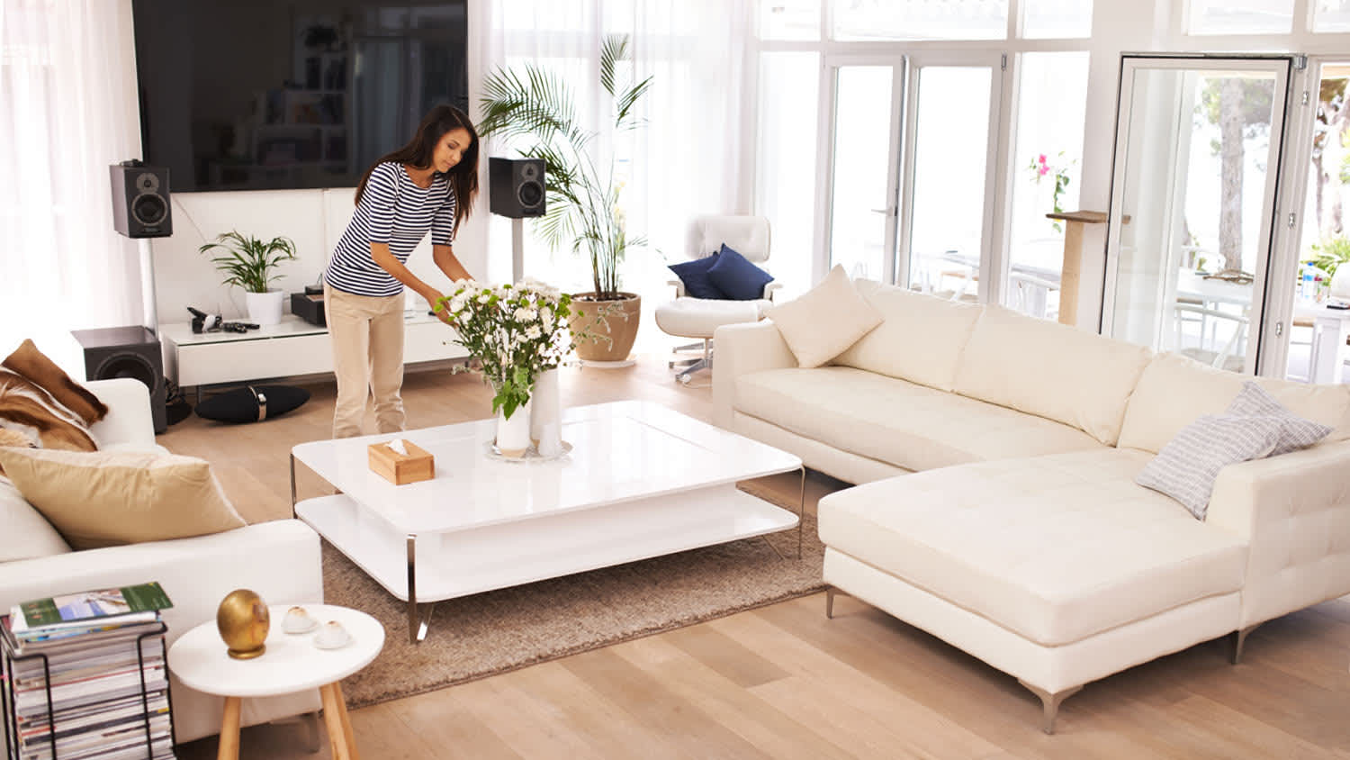 woman freshening up home with flowers