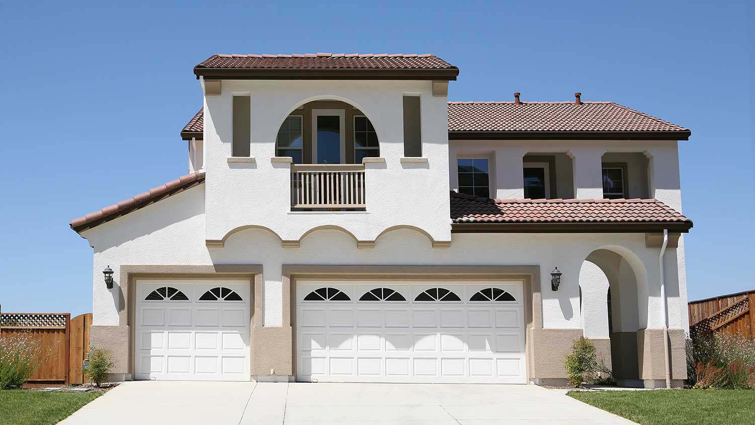 White stucco house with arches
