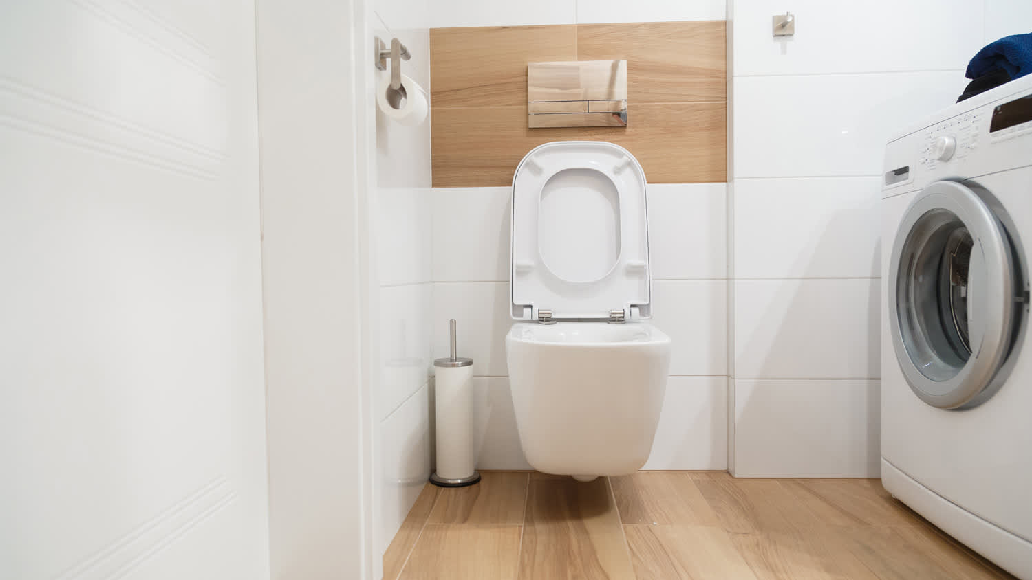 A toilet bowl in a modern bathroom