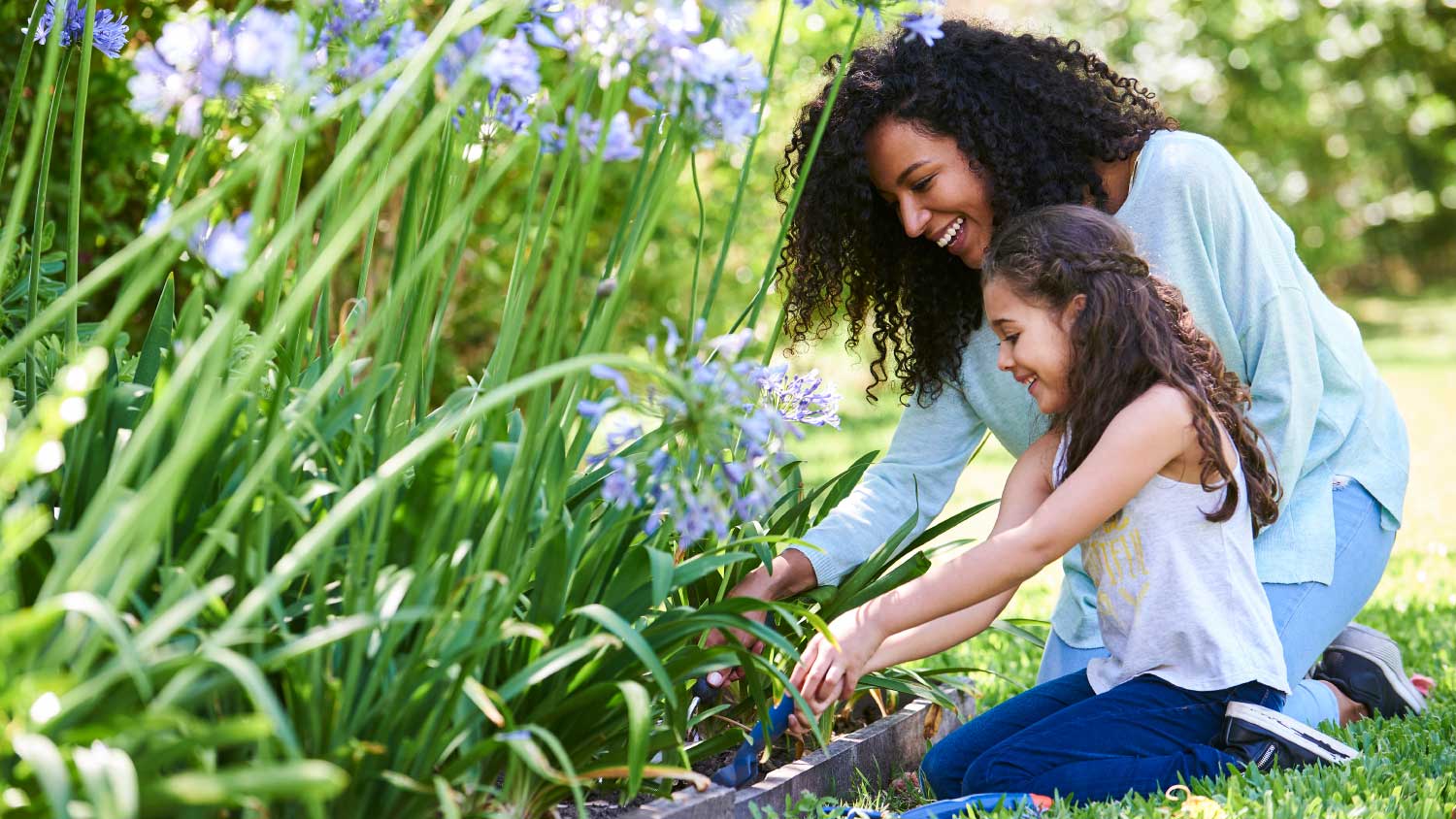 mother and daughter gardening together