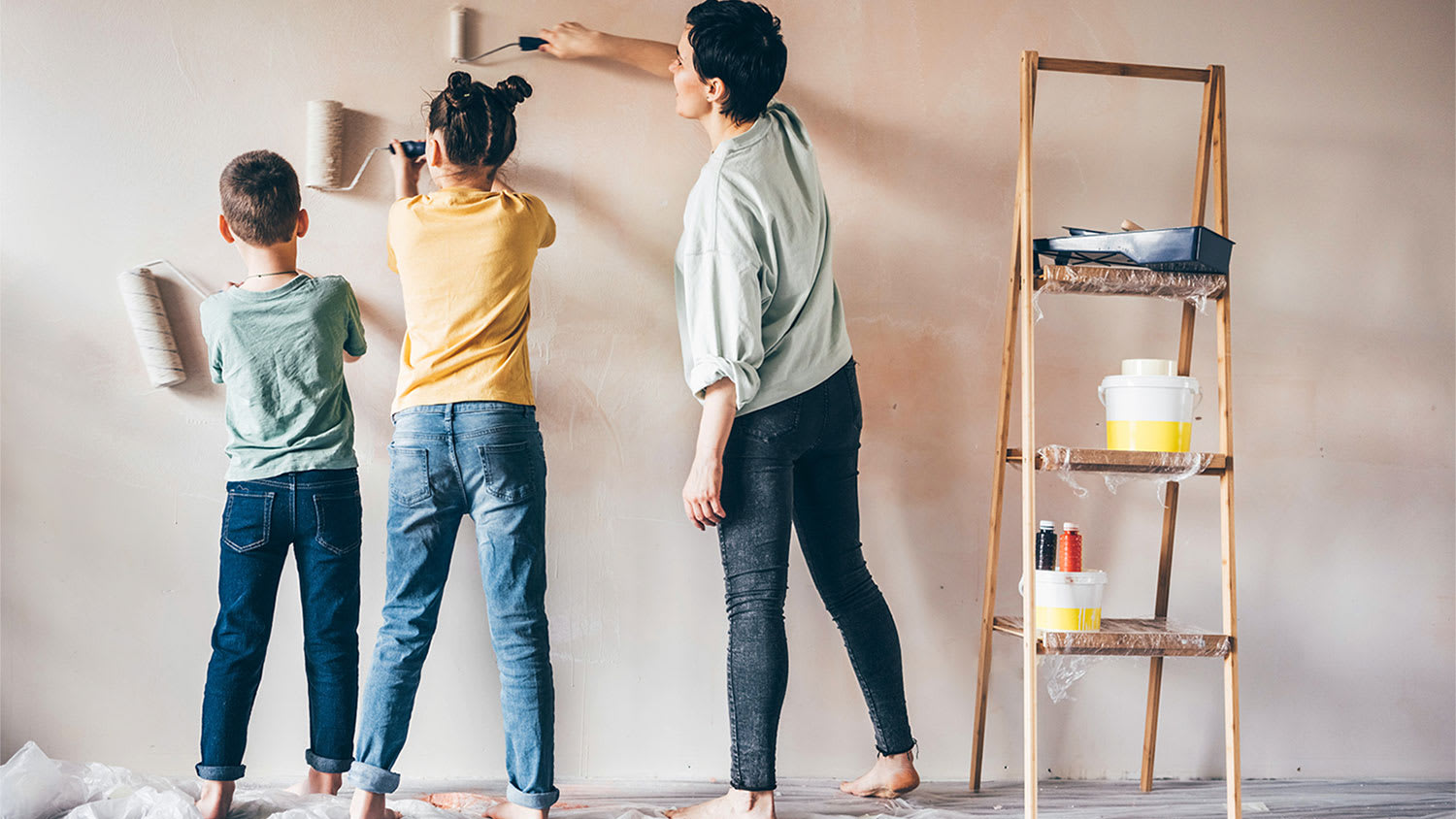 A family paints walls