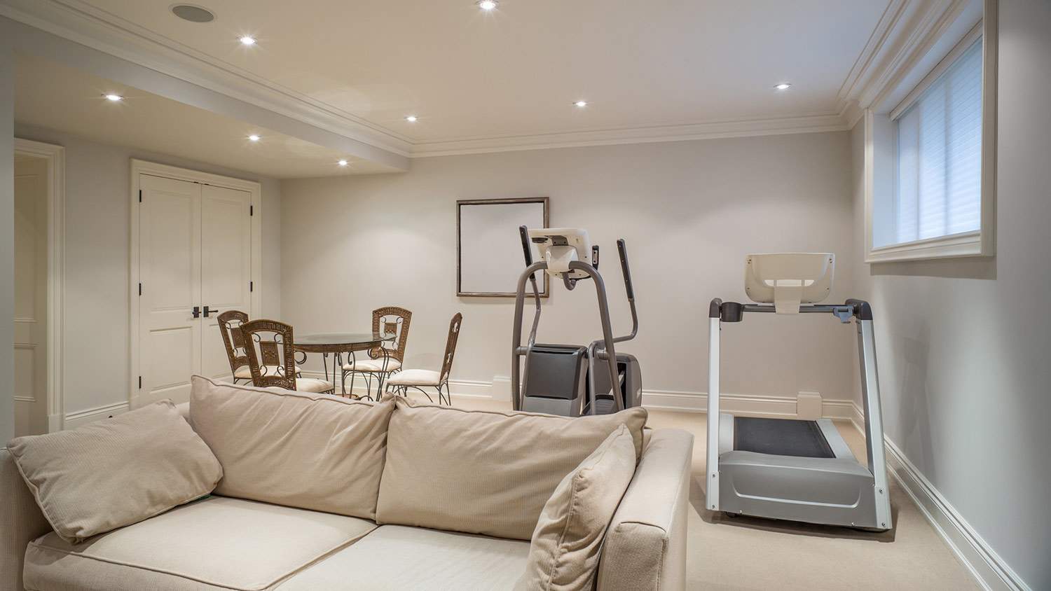Exercise area in a finished basement in house