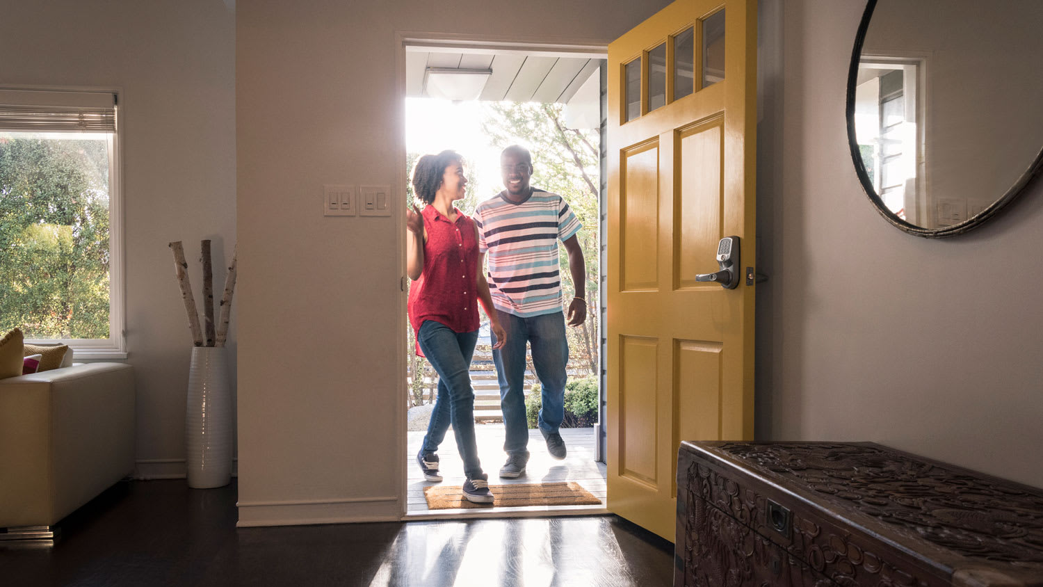 A couple arriving at their house