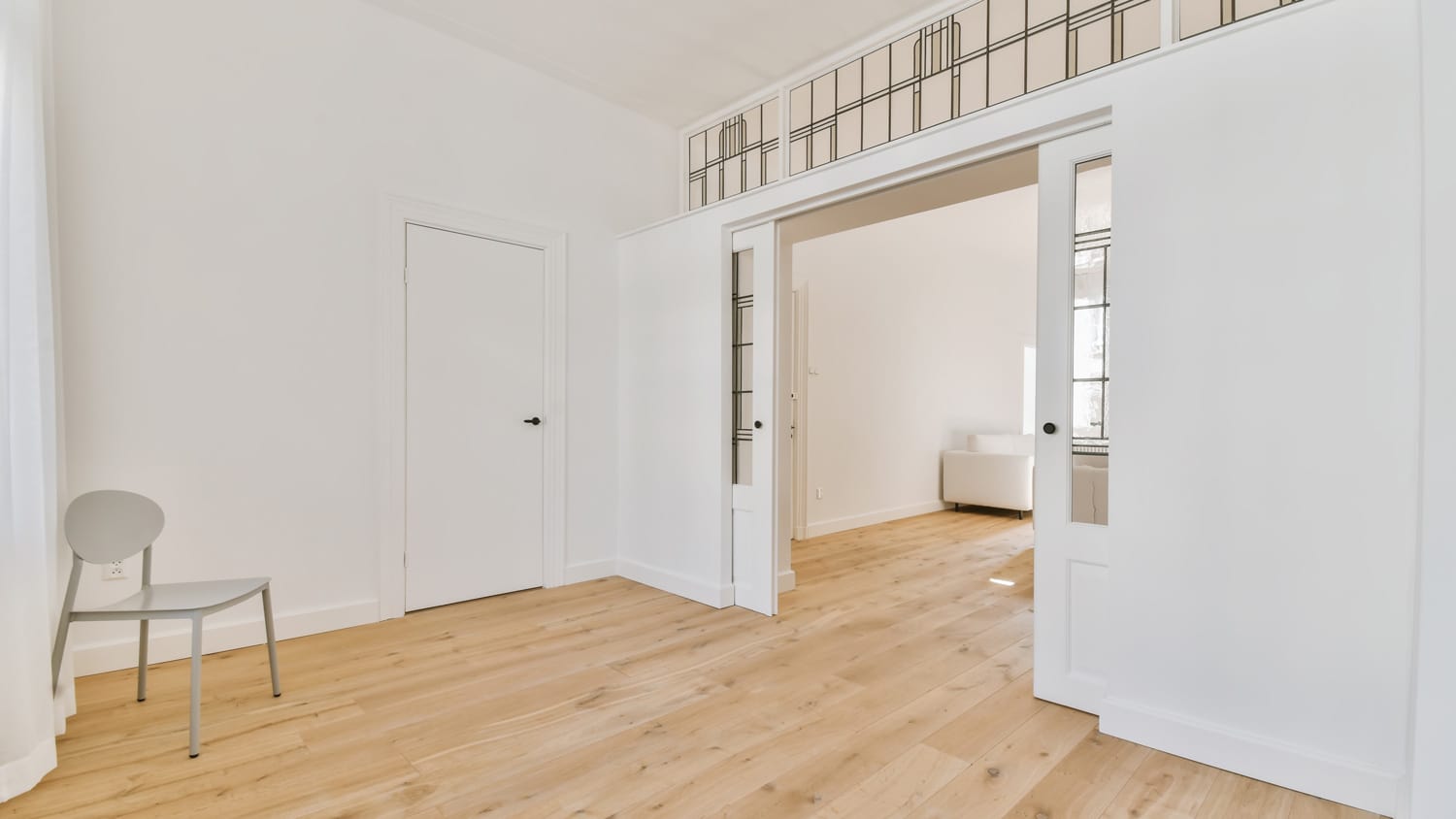 A pocket door in a spacious interior