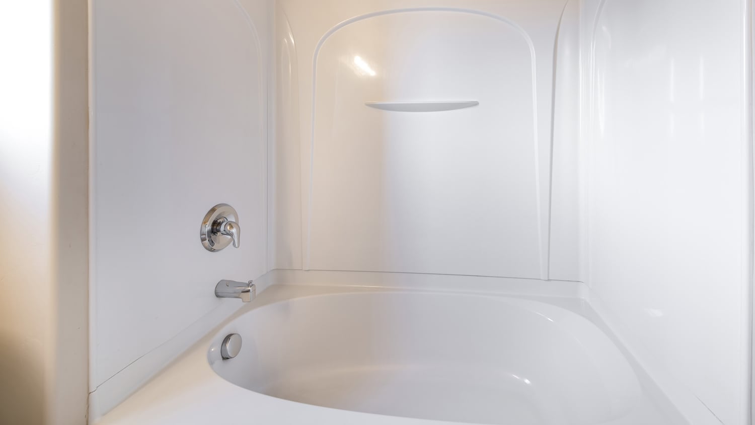 A bathtub with acrylic surround