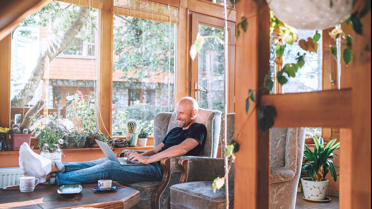 Man sits in sunroom