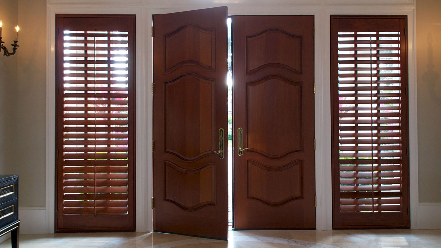 Wood shutters flank front door