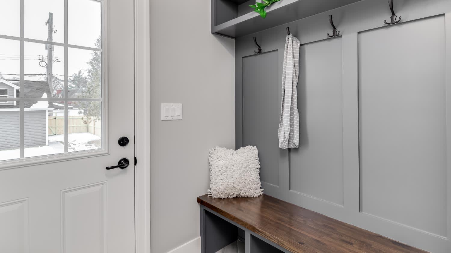 An entryway with bench
