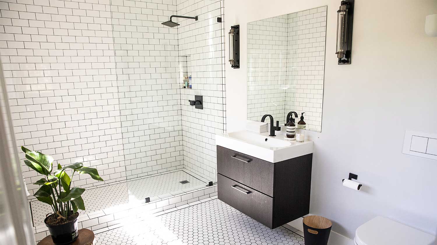 A bathroom with a walk-in shower