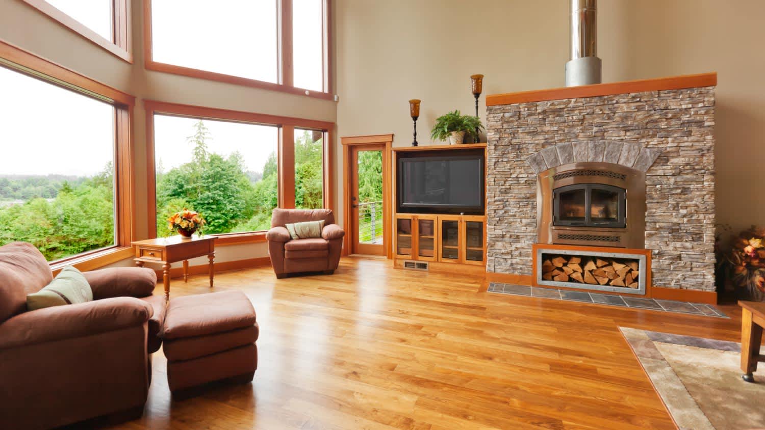 A fireplace with large windows