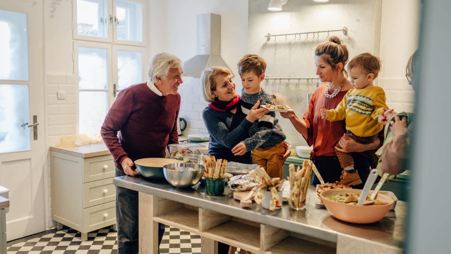 Family preparing Thanksgiving dinner in the kitchen