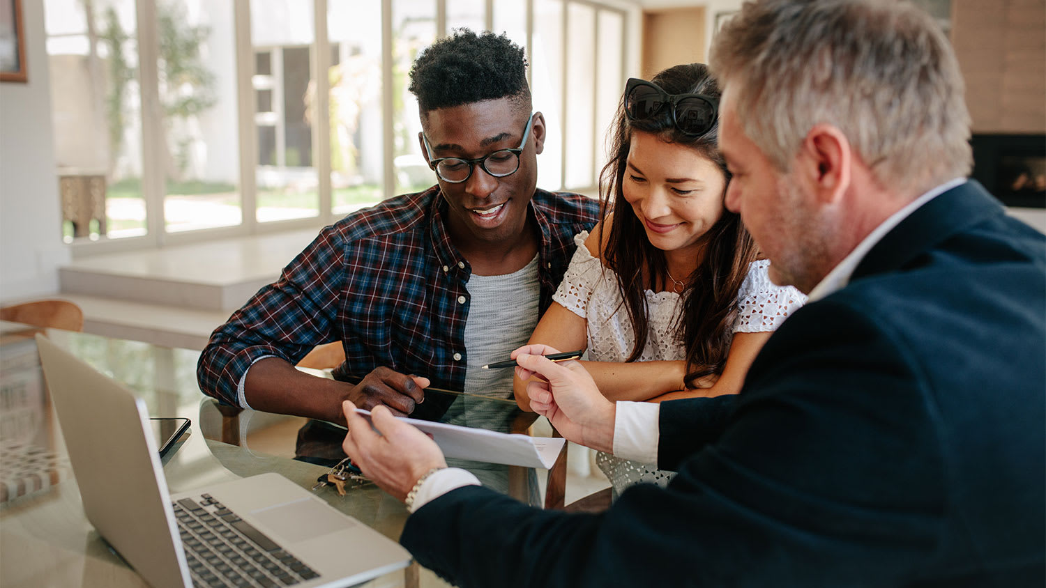 A couple signs a real estate contract
