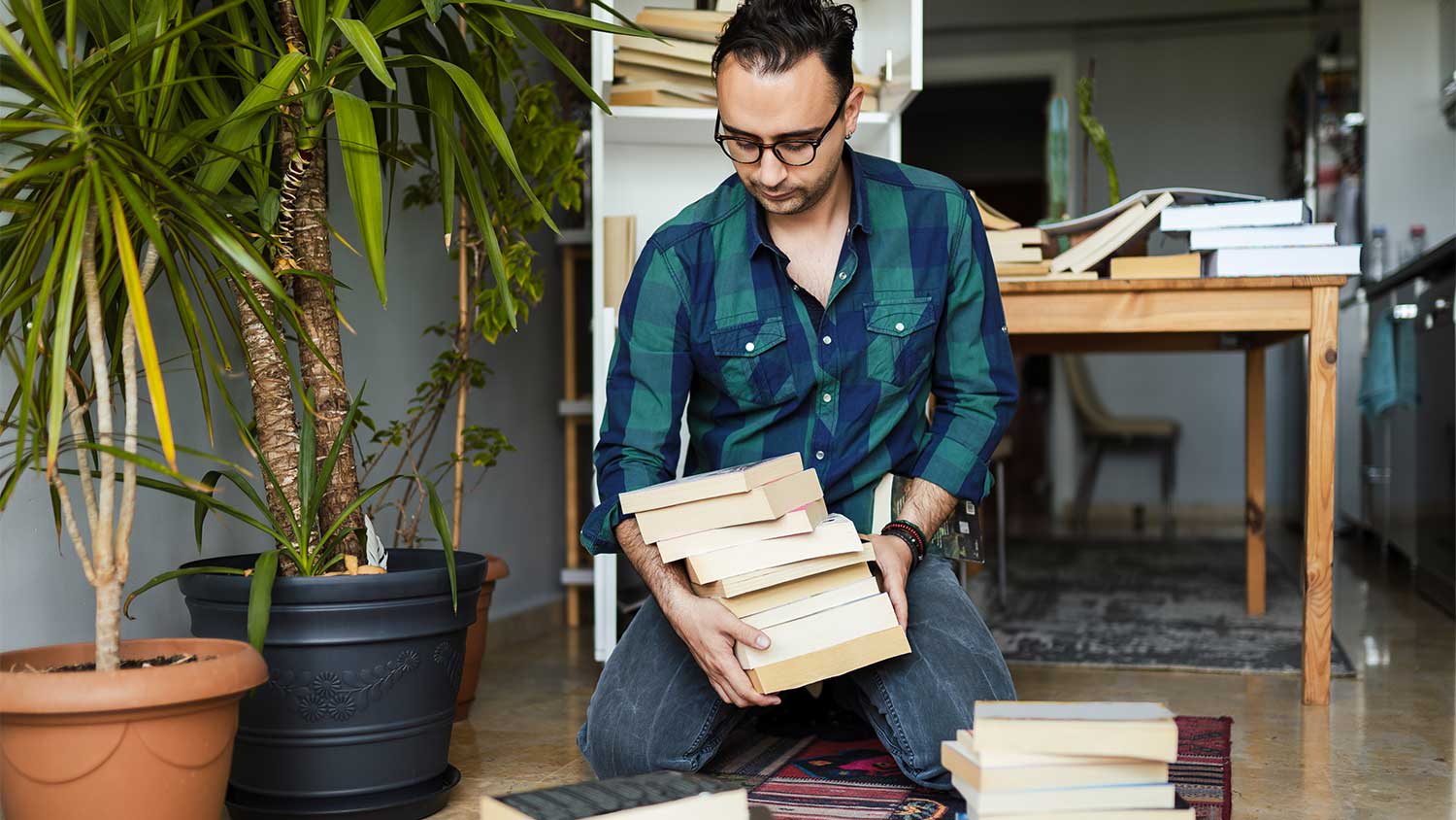 Man organizing books