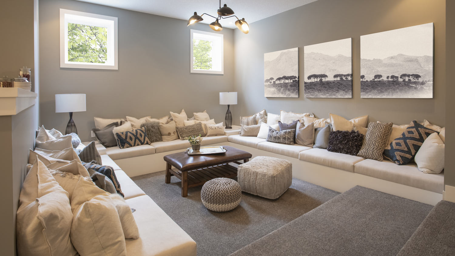 A finished basement with a lounge area