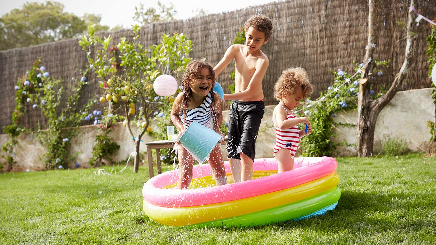Children play in a wading pool