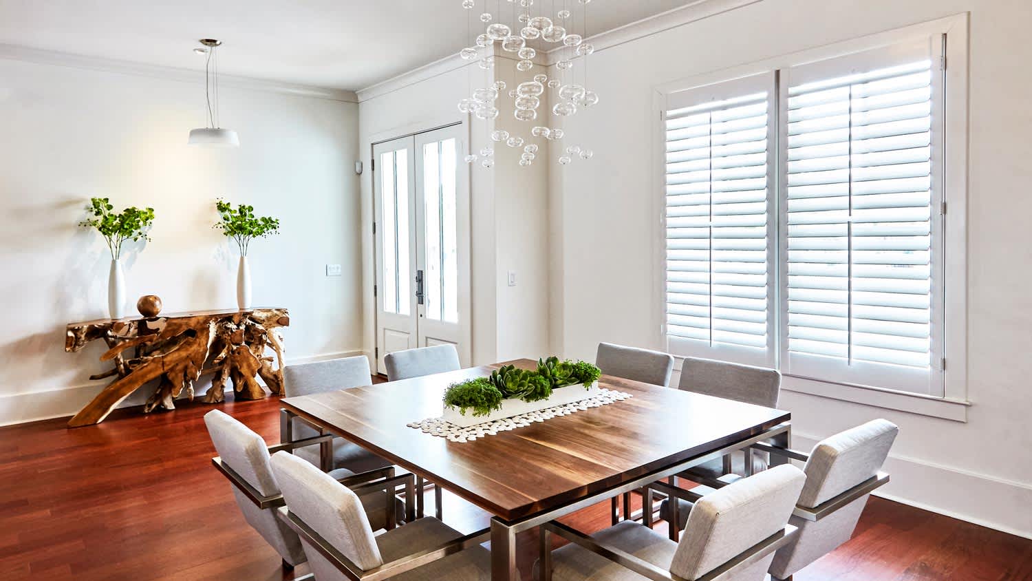 A dining room with the shutters being closed