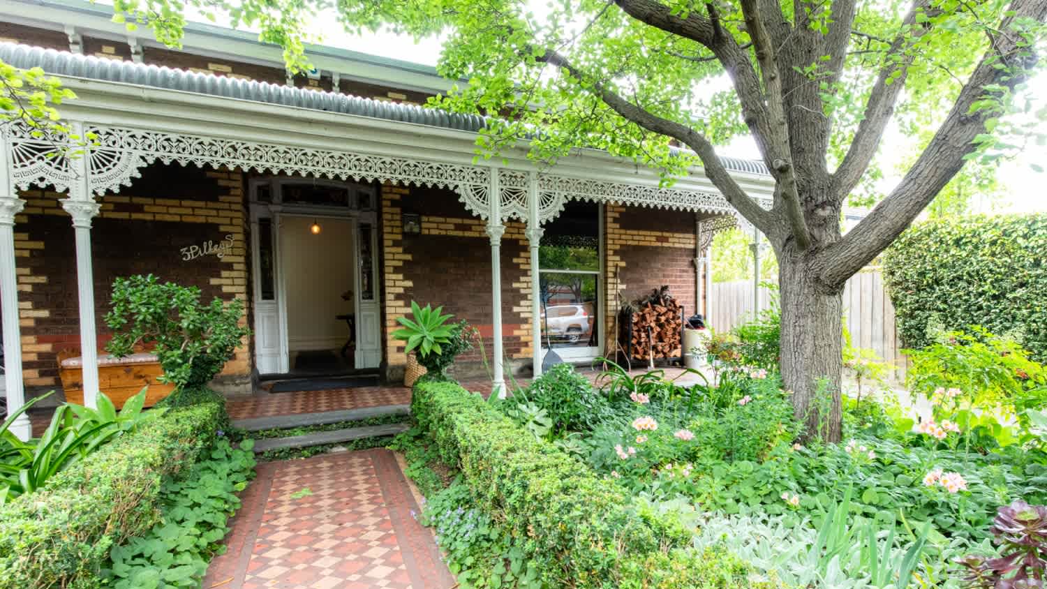 A front yard of victorian style house