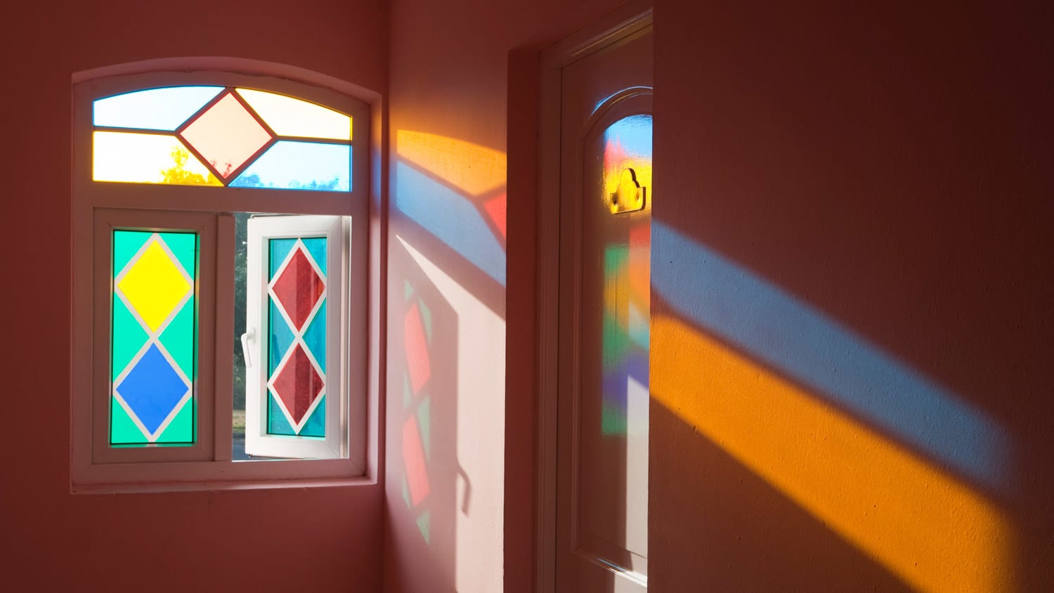 A stained glass window with colorful reflections
