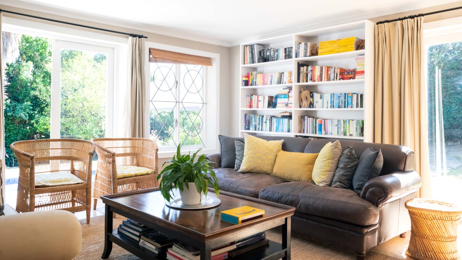 sunny living room with multiple entries