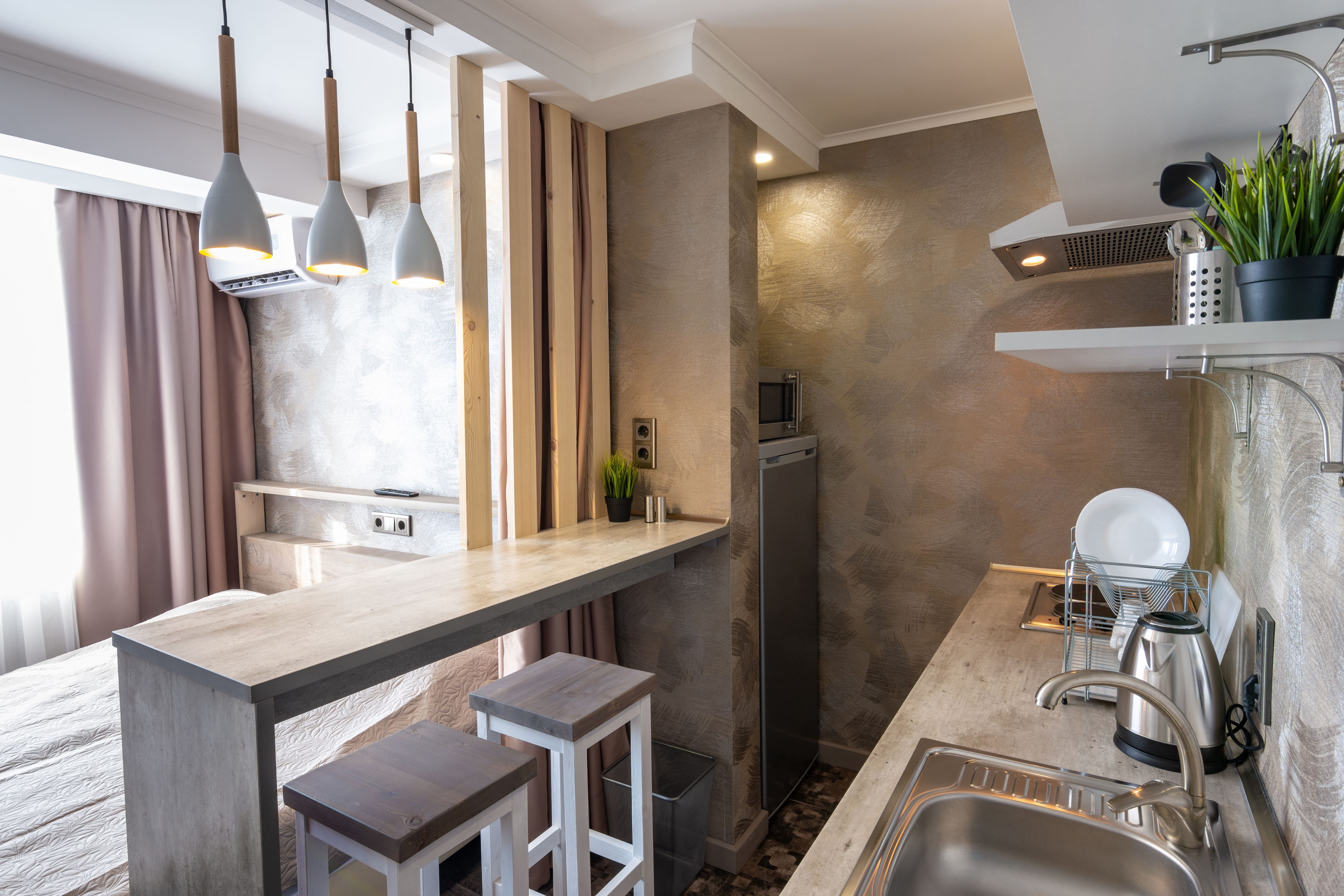 A small galley kitchen in a studio apartment
