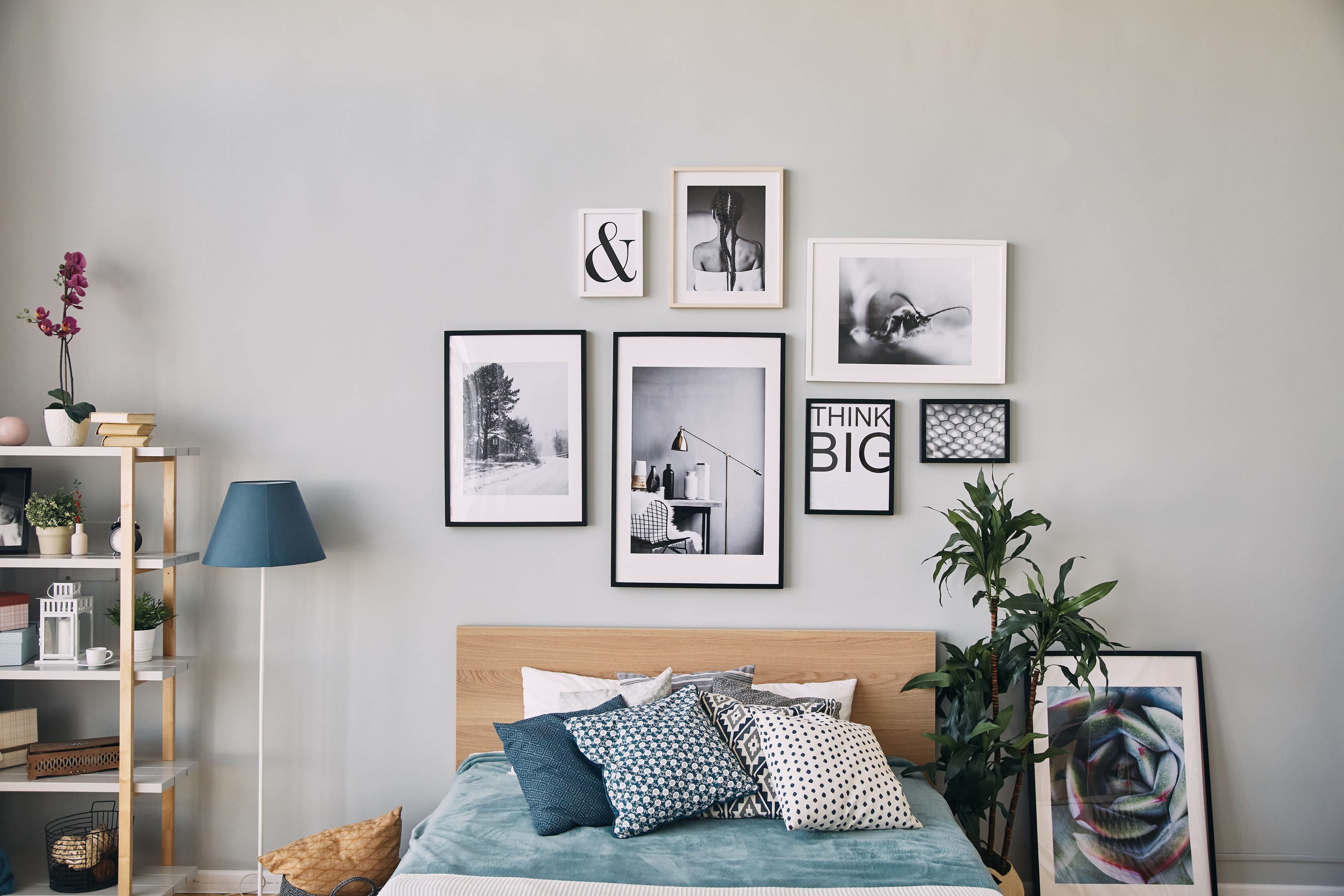 A small bedroom with light gray walls